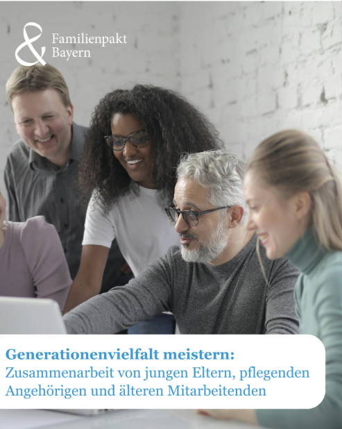 Ein Bild mit Personen in unterschiedlichem Alter vor einem Computer